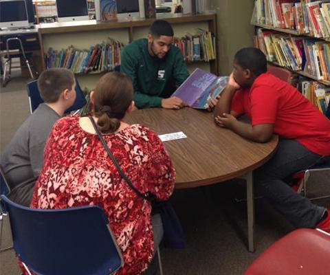 Sage men's basketball participates in Carroll Hill School Hoops and Literacy Program