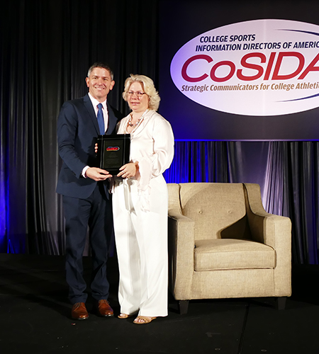 2017-2018 CoSIDA President Rob Carolla presents Ann King with Mary Jo Haverbeck Trailblazer Award