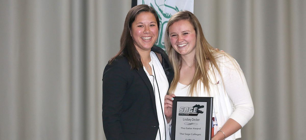 Head softball coach Erica Li awards Gator of the Year status to Lindsey Decker.