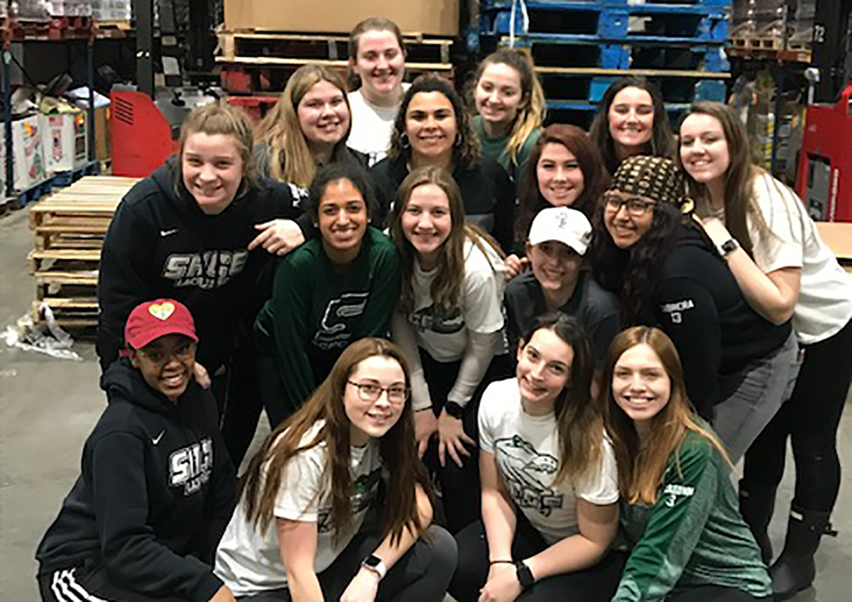 Sage women's lacrosse teams spends an afternoon assisting at Regional Food Bank of Albany