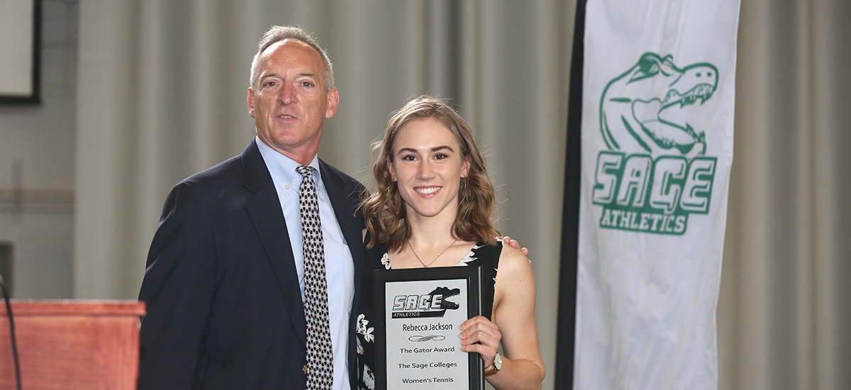 Head Tennis Coach Tom Fashouer presents Rebecca Jackson with Gator of the Year honors.